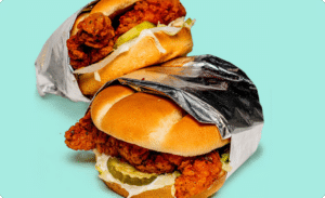 A photo of two nashville hot chicken tender sandwiches